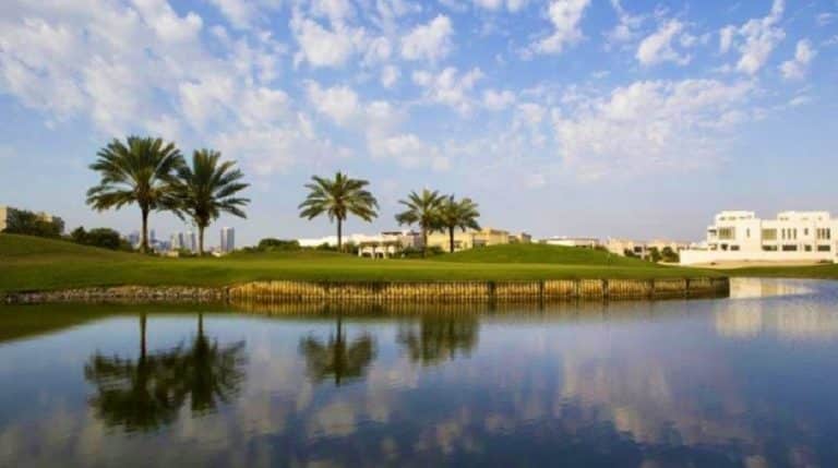 Address Montgomerie Golf Club - Lake and Clubhouse