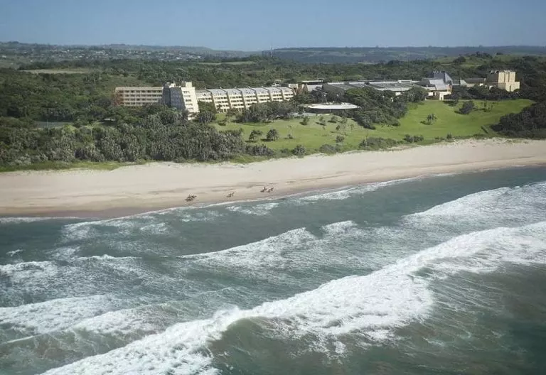 Aerial view of coastline and Wild Coast Sun